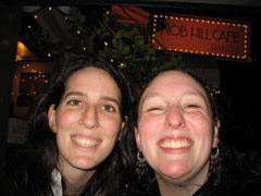 Julie and Sasha, sopping wet after a day of walking around San Francisco in the rain, outside the Nob Hill Cafe