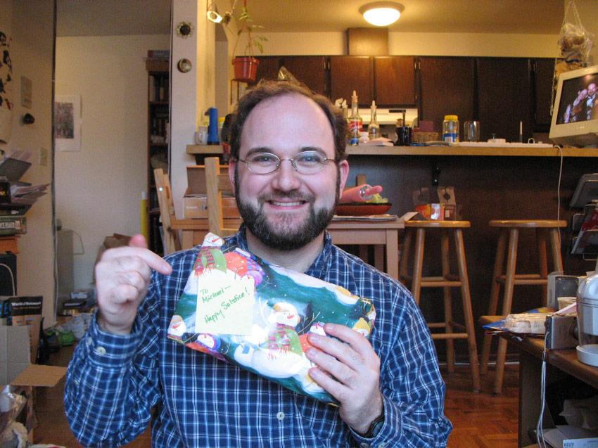 Michael opening a present