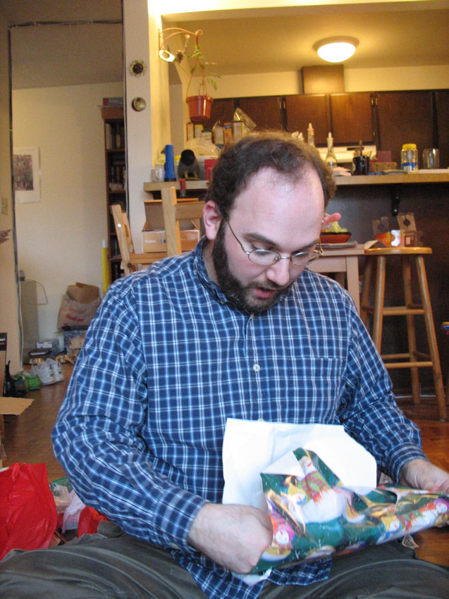 Michael opening a present