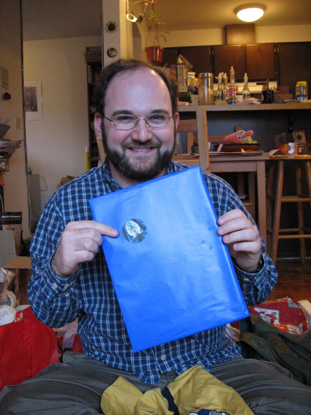 Michael opening a present