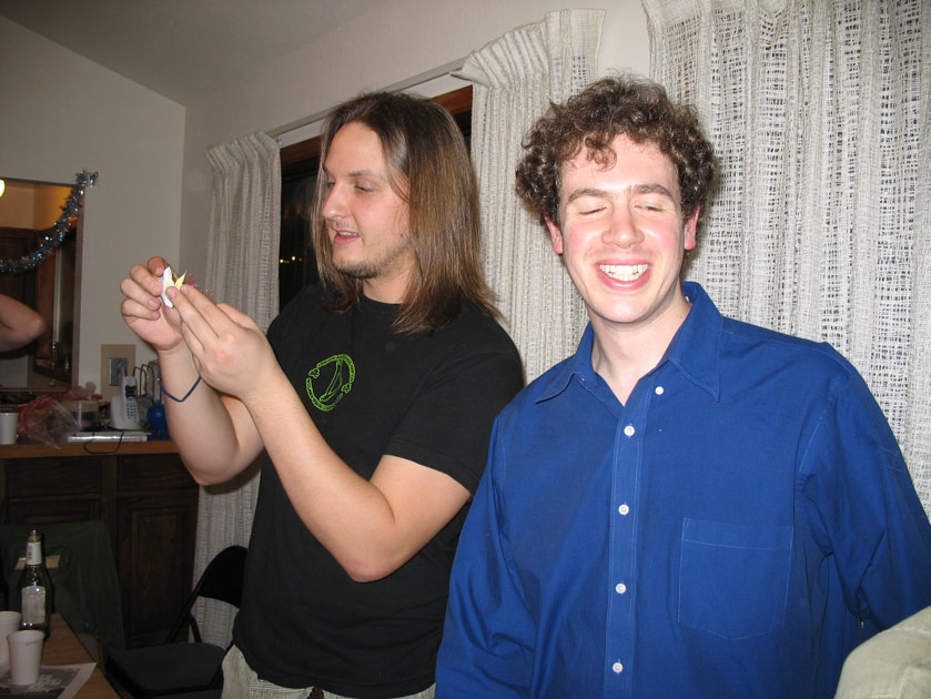 Justin and Andy play with their cracker toys