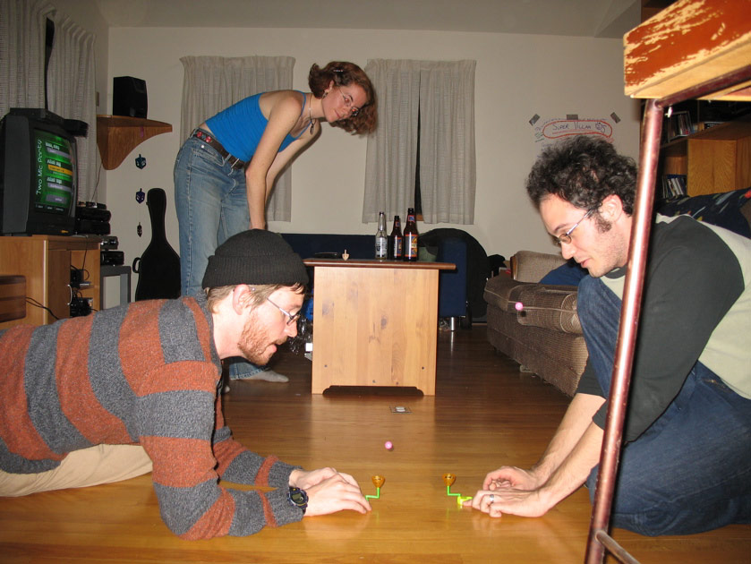 Mike and Destry play with their cracker toys