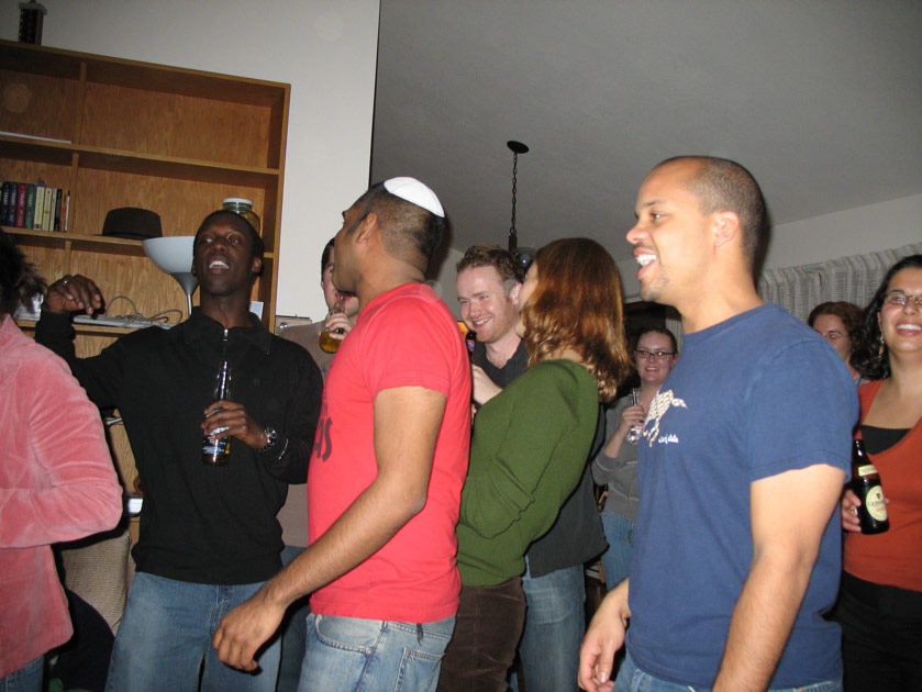 Kofi, Mo, John and other guests watch the karaoke