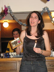 Julie lights a candle for Grandma Duda