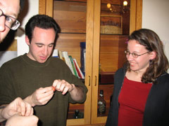 Mike, Noah, and Kristen play with their cracker toys