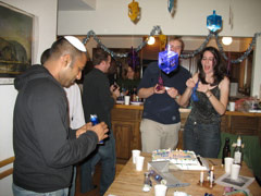 The guests play with the toys from their crackers