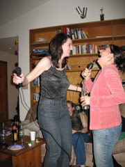 Julie and Erin sing karaoke